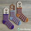 Cubicle Socks Trio Knitting Pattern: Three 3-color socks with a knit mosaic color pattern