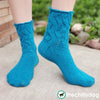 Riptide Socks Knitting Pattern PDF featuring Cobasi by HiKoo® yarn in the 2020 Color of the Year, Kind of a Big Teal: Top down sock pattern for women