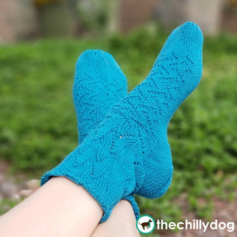 Riptide Socks Knitting Pattern PDF featuring Cobasi by HiKoo® yarn in the 2020 Color of the Year, Kind of a Big Teal: Top down sock pattern for women